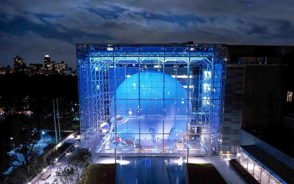 Illuminated glass exterior of the Rose Center for Earth and Space
