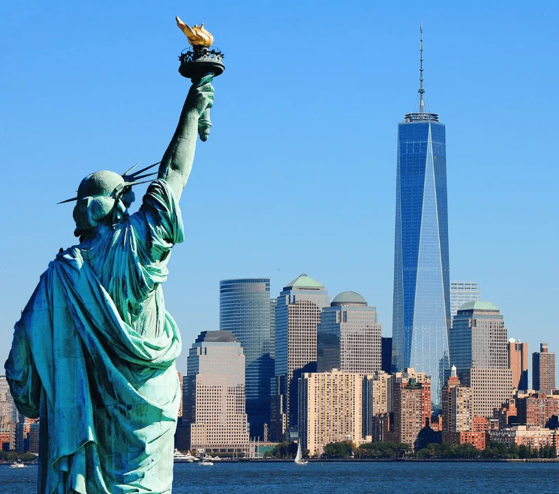 Statue of Liberty with One World Trade Center across the harbour