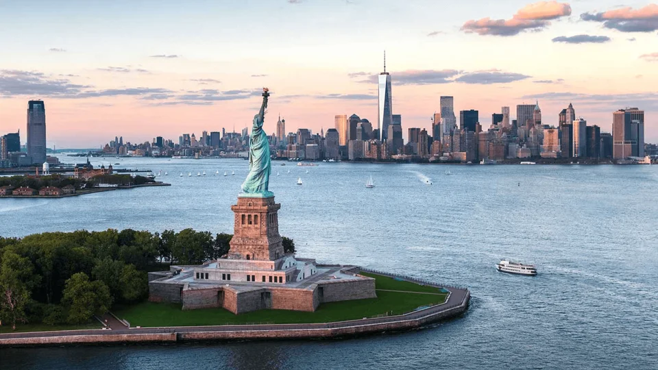 Liberty Island and the Statue of Liberty with Manhattan across the harbour