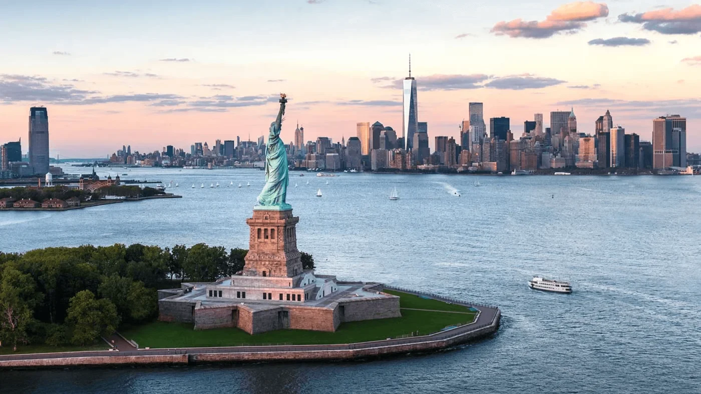 Liberty Island and the Statue of Liberty with Manhattan across the harbour
