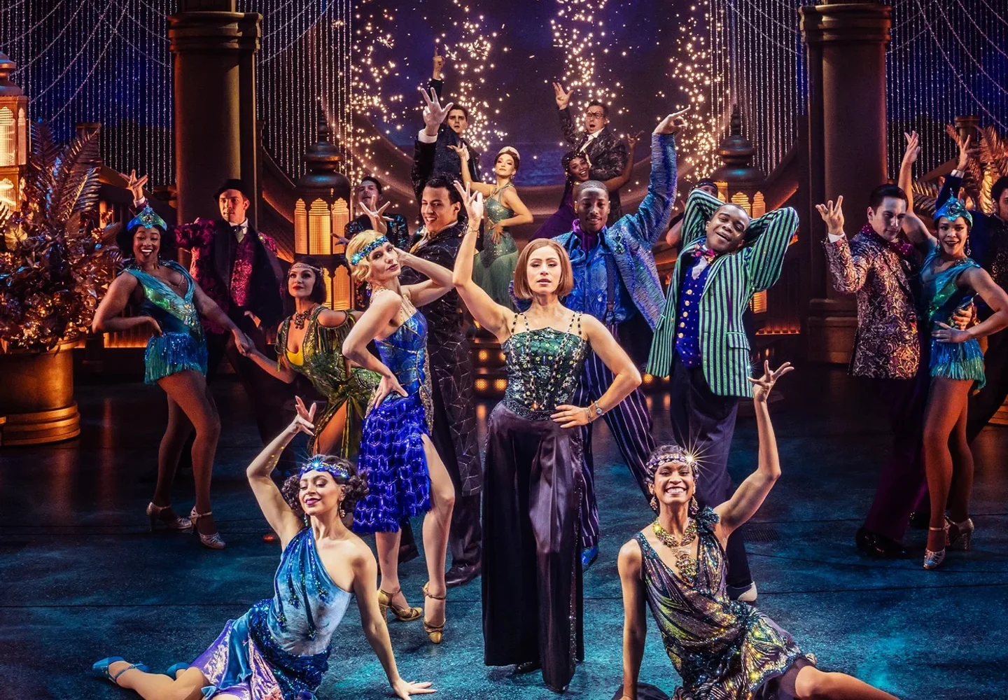 The Great Gatsby ensemble in evening dress on a glittering party set